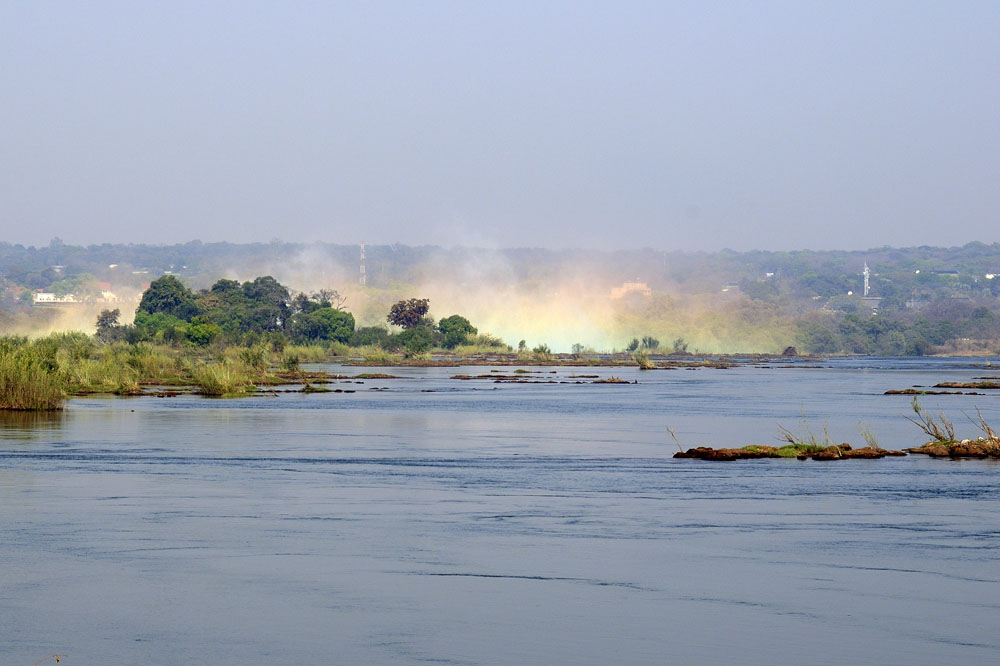 Rainbow in mist rising out of Victoria Falls