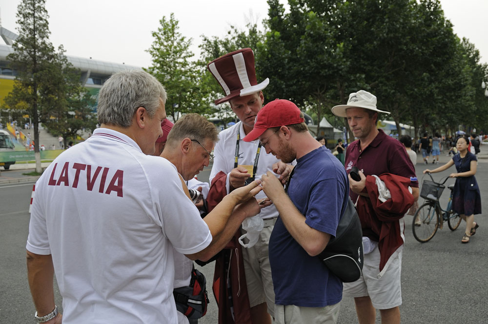The Latvians trading at the weightlifting venue