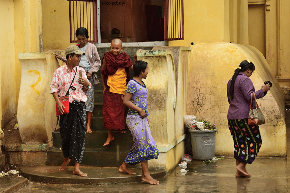 Young monk and family at Shwezigon Pagoda