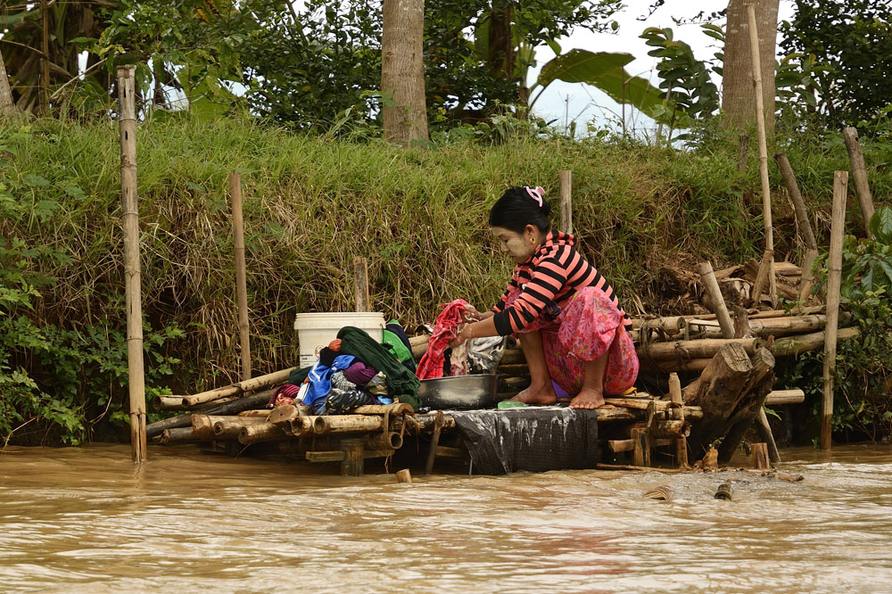 Cleaning clothes on the riverbank
