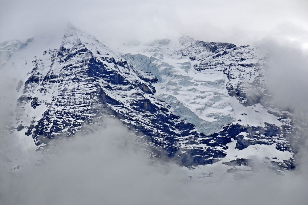 Peering through the clouds at a glacier