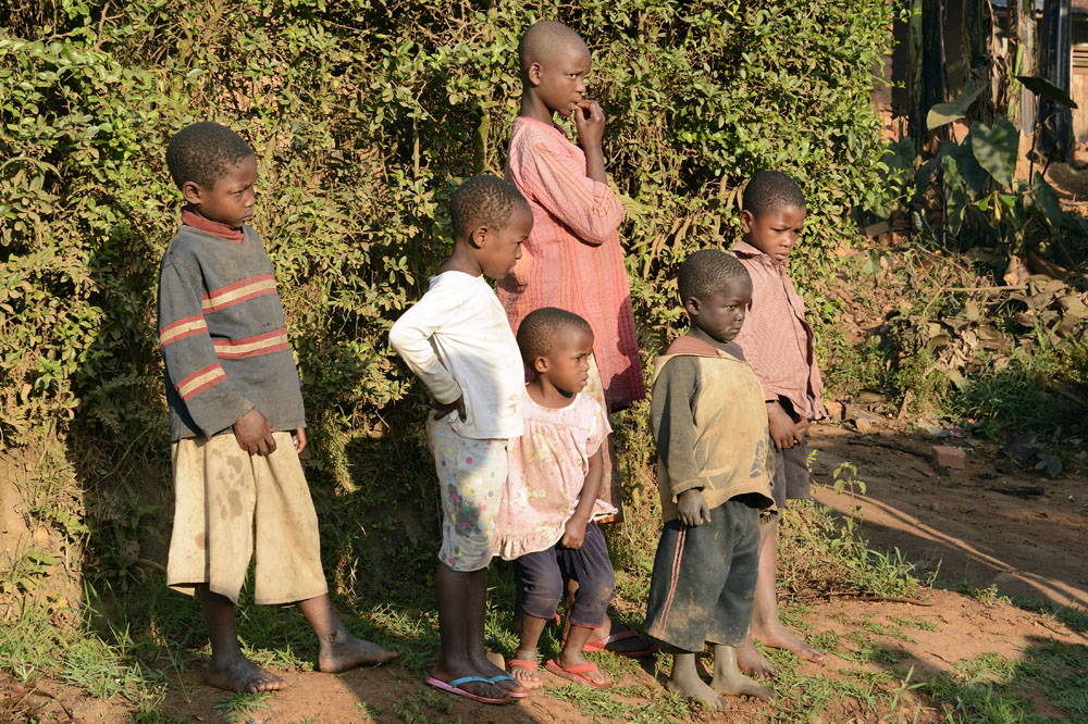 Children watching flat tire being changed