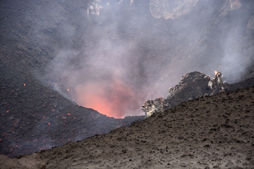 Looking down into volcanic crater from its rim