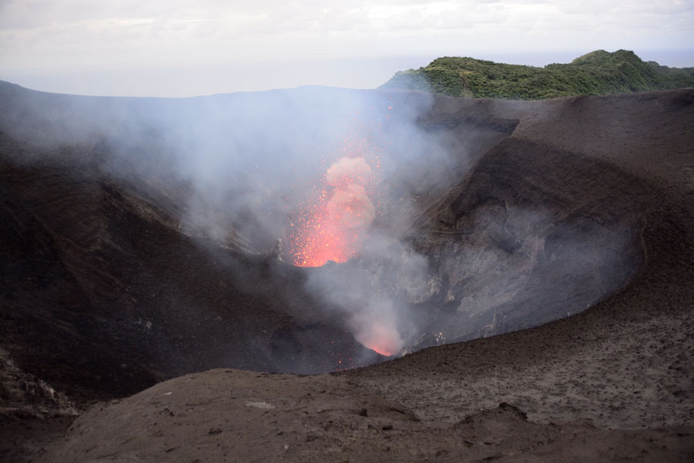 Both vents erupt, here the more distant one is erupting