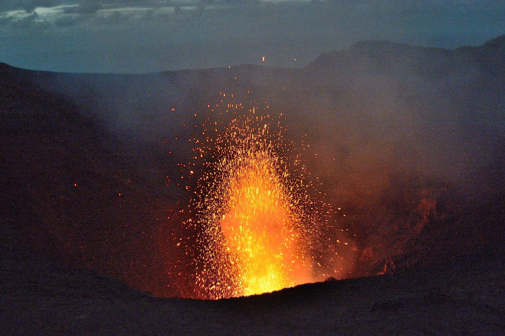 Three images of another eruption, this one more vertical and higher